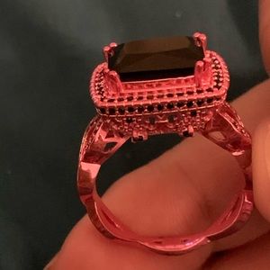 Fashion jewelry, pink ring with black stone accent. EUC